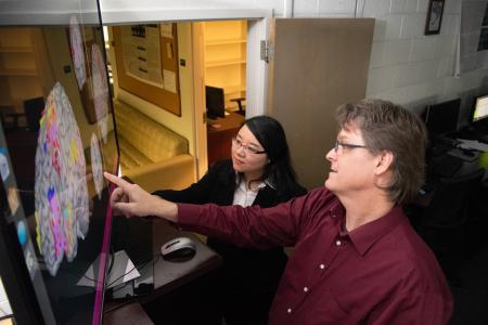 Dr. Liu explaining her research